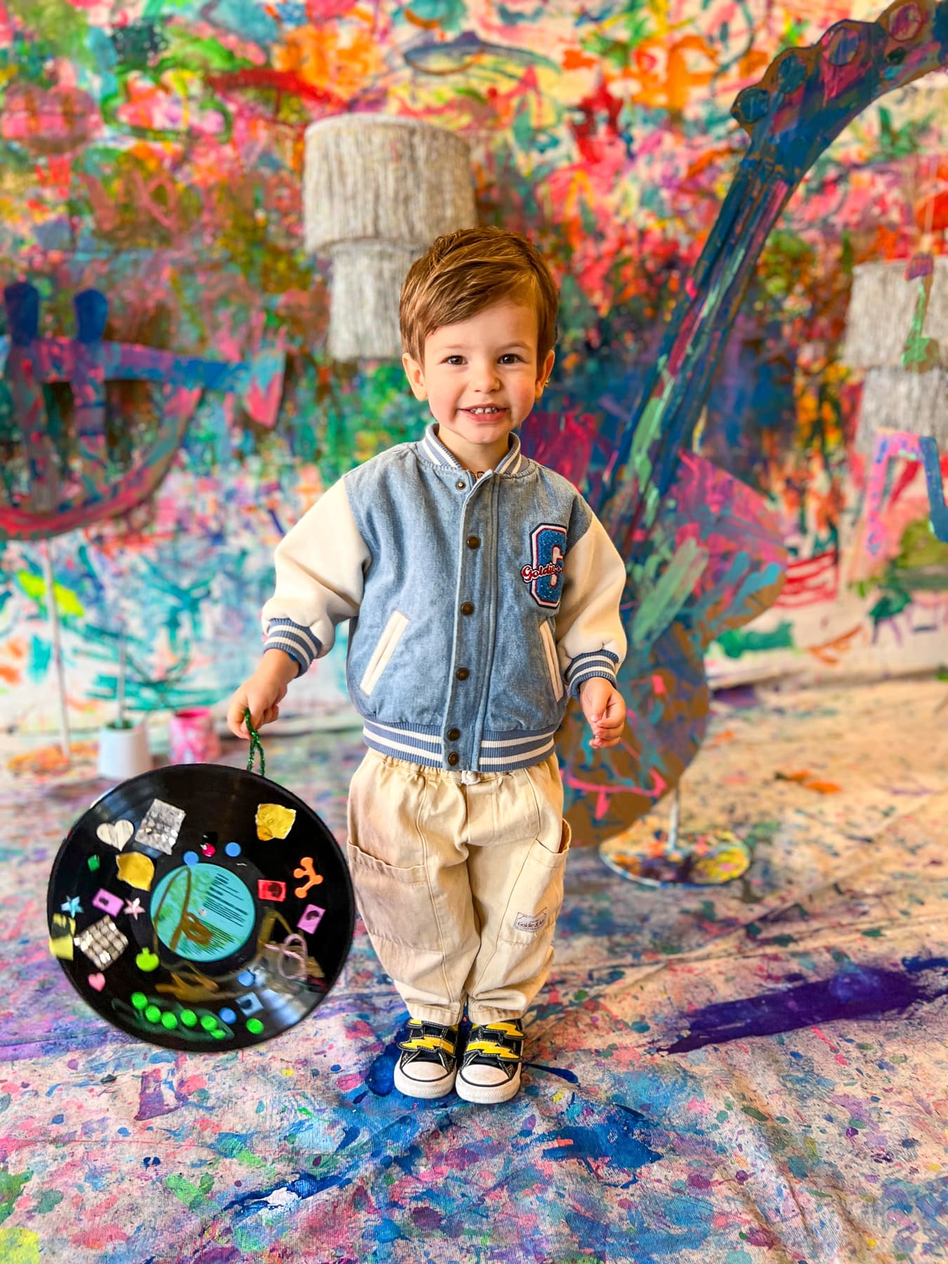 Smiling boy with painted record
