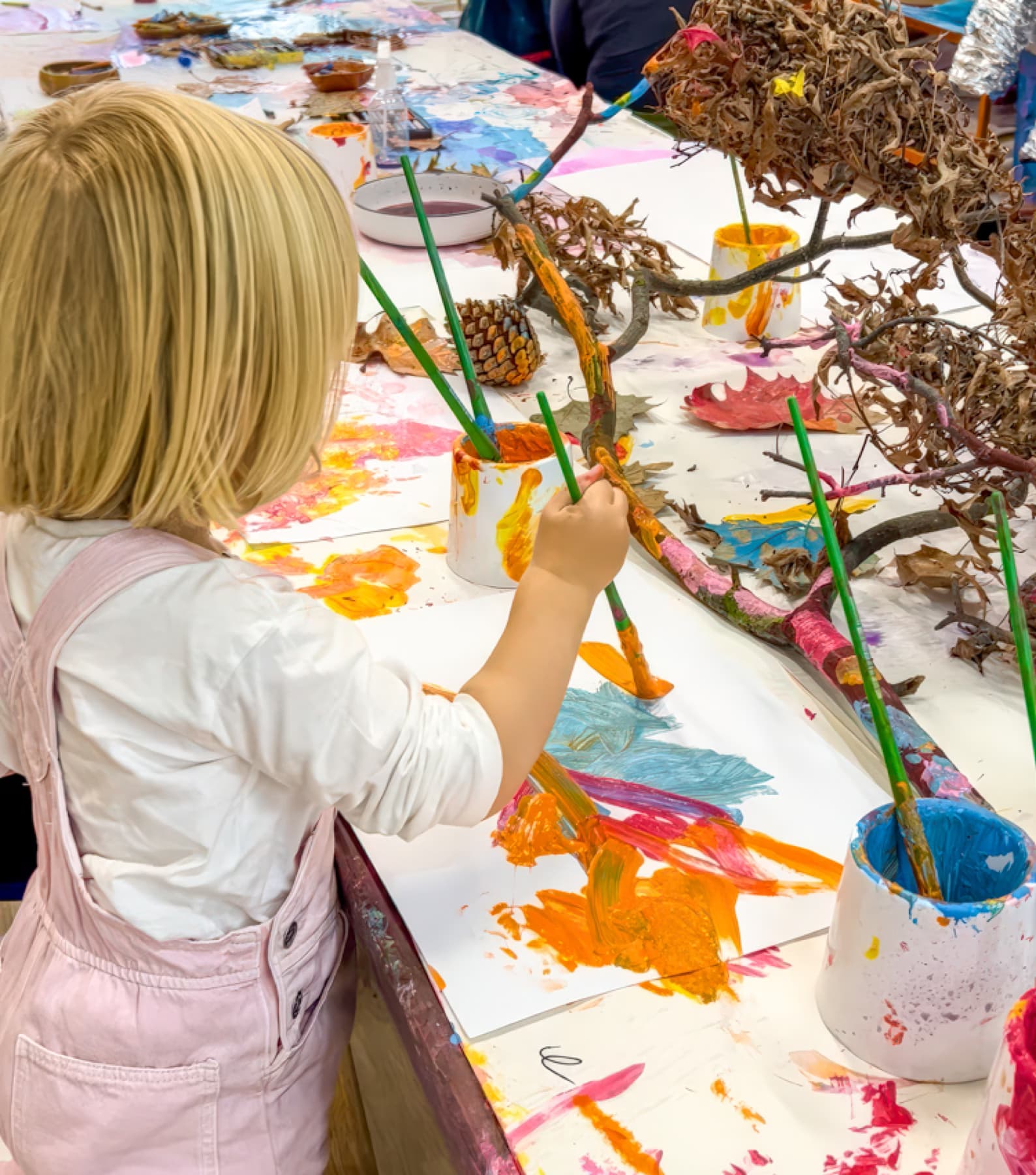 Toddler painting with nature materials