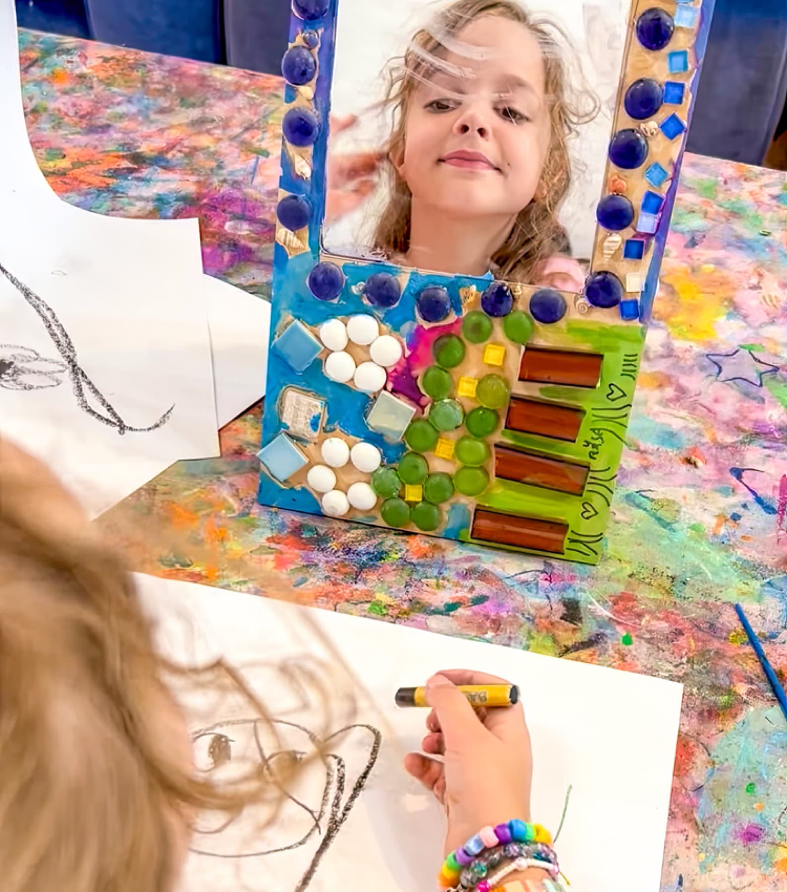 Girl with decorated mirror frame