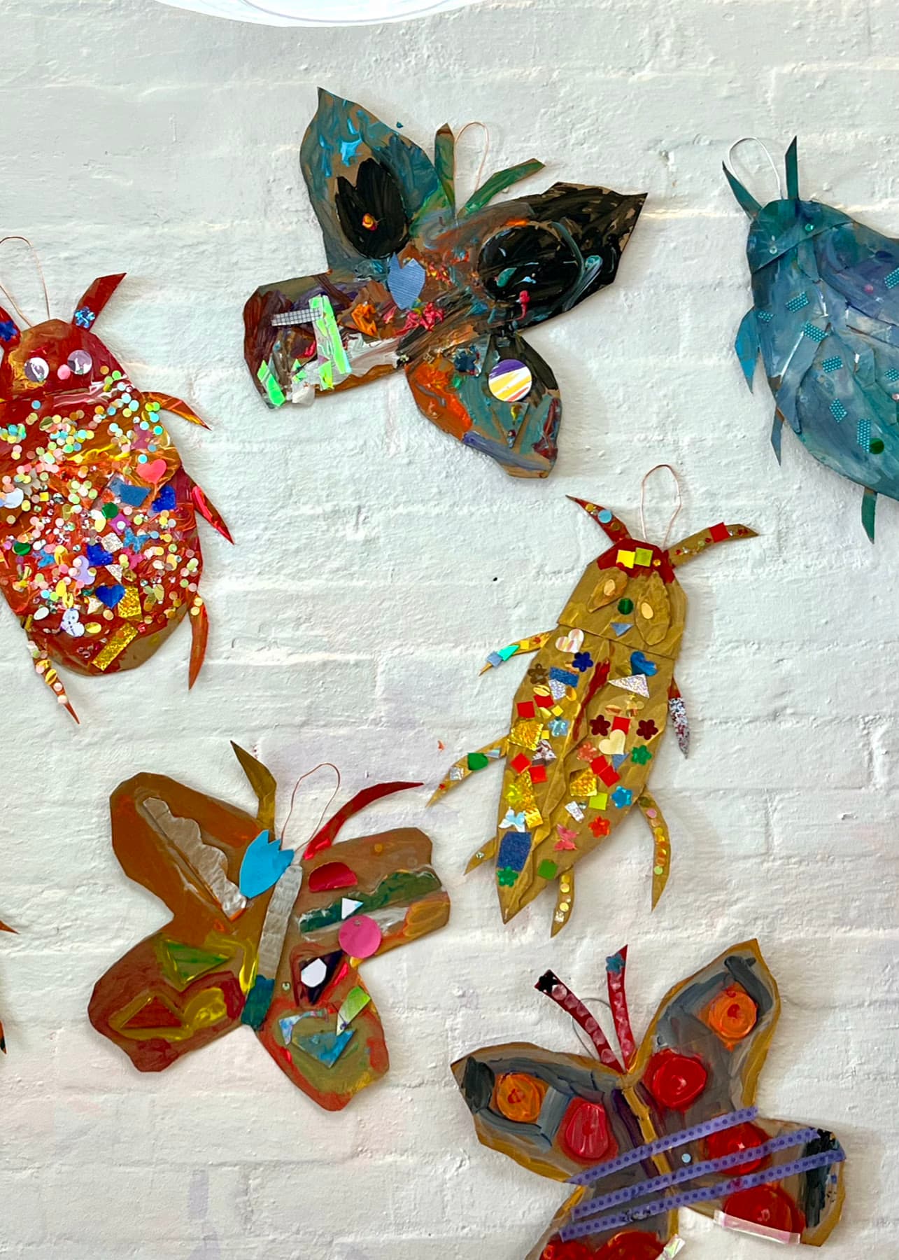 Colourful butterflies and bugs on wall