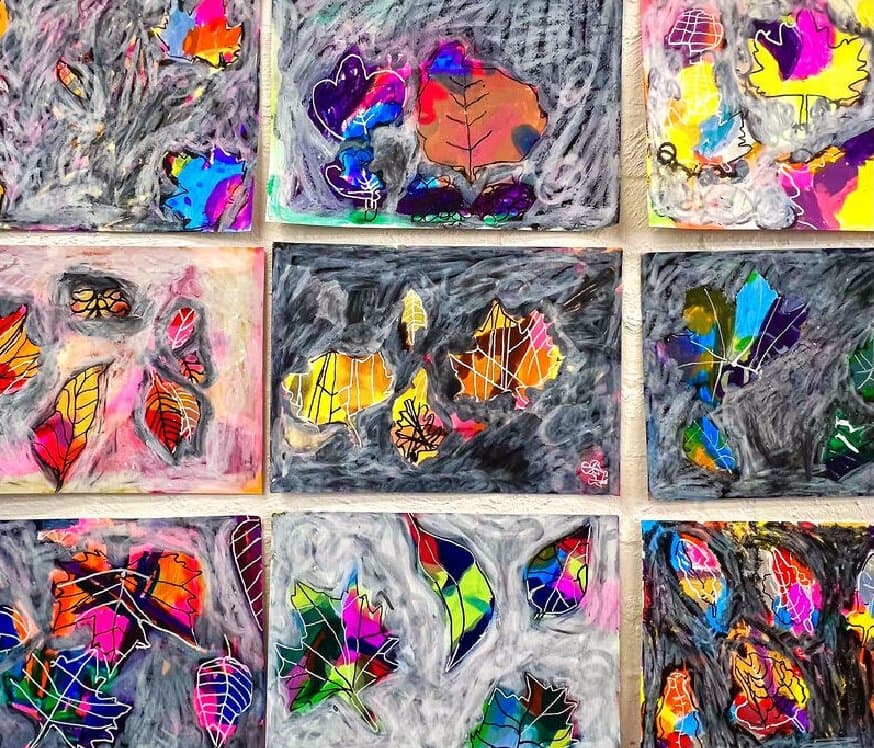The Nature Days cover photo, a wall of bright leaf and butterfly artworks