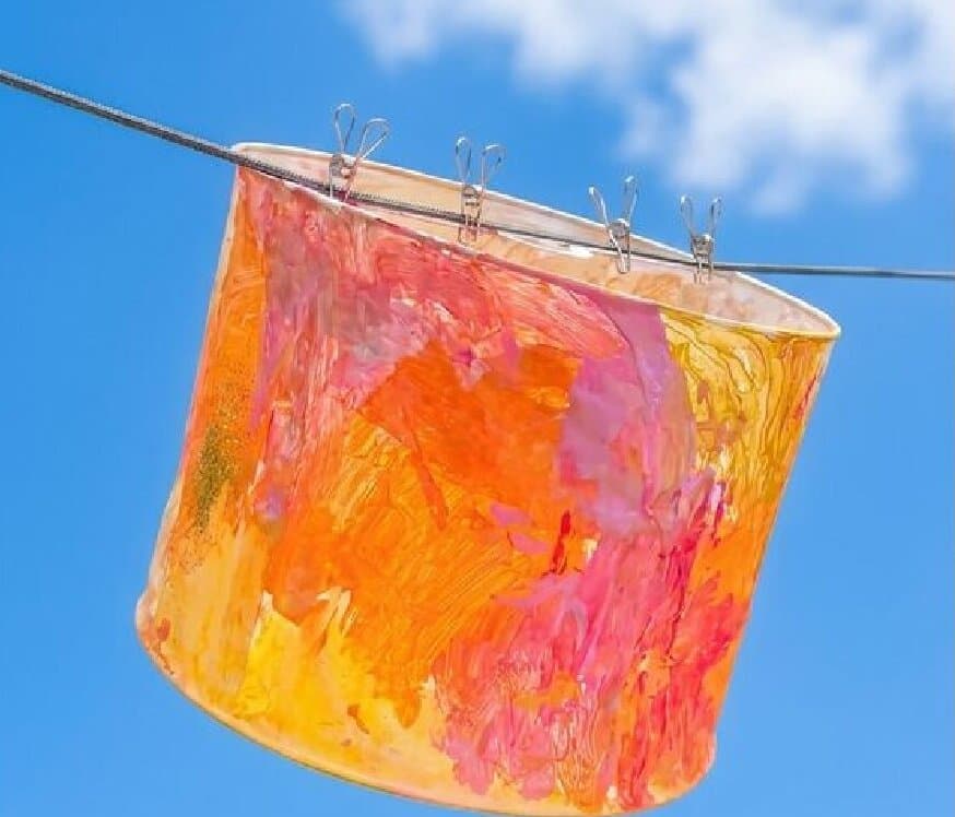 The Sunny Days cover photo, a painted paper lantern hanging against a blue sky